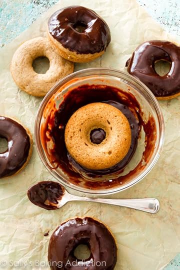 Baked banana donuts covered in a silky smooth dark chocolate glaze-- so decadent, yet totally simple to make!