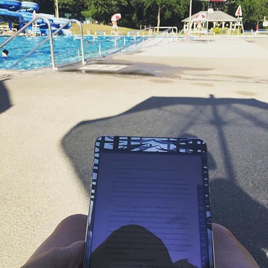 #amreading at the pool in the shade of an umbrella. Not many more days left of this. #365days #ig2015 #dailyphoto