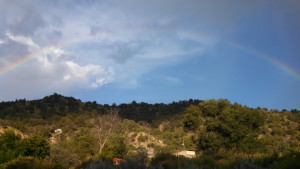 Monsoon rainbow over the Funky Butte Ranch. 2008's Farewell, My Subaru tells the story of my journey to live without fossil fuels but pointedly with Netflix.