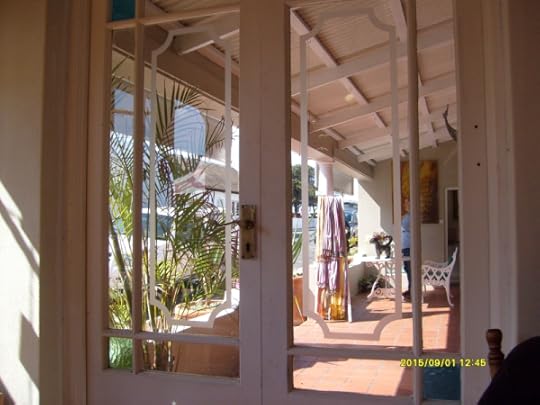 We had coffee in the Old Harbour Cafe, and beyond it was an art gallery, glimpsed here through the door at the end of the veranda