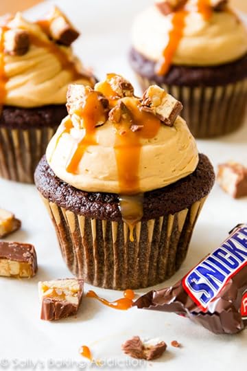 Ultimate Snickers Cupcakes-- grab the ridiculously awesome cupcake recipe on sallysbakingaddiction.com