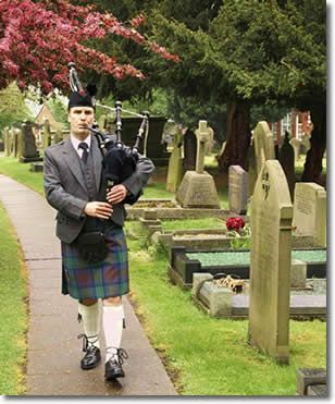 funeral bagpipe player: funeral bagpipe player