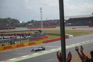 Lewis Hamilton takes the chequered flag at Silverstone