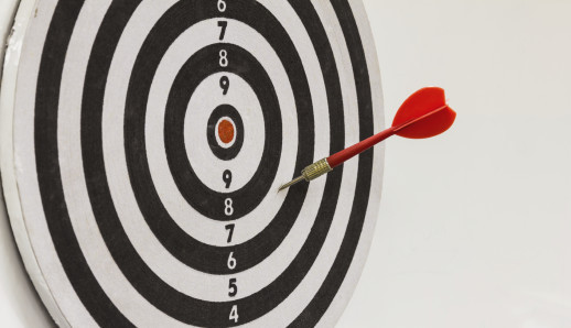 Red dart on black and white dartboard
