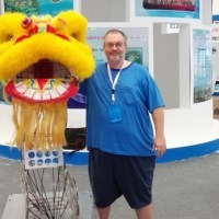 Russell Cameron setting up his dancing Chinese lion robot.