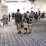 A family makes their way through the National Book Festival at the Walter E. Washington Convention Center, September 5, 2015. Photo by Shawn Miller.