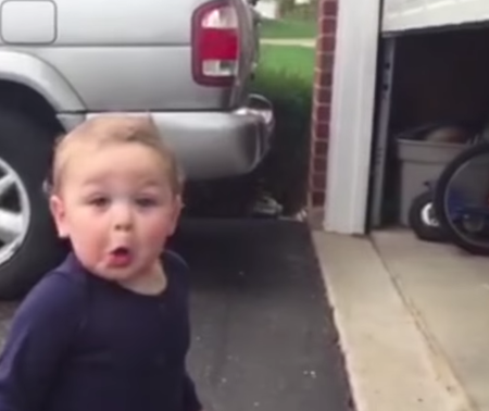 Kid reacts to garage door