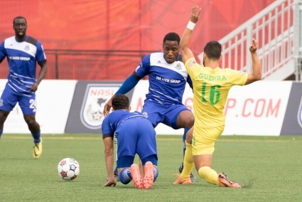 Eddie Edward, middle, in action against the Tampa Bay Rowdies. PHOTO: FC EDMONTON/TONY LEWIS
