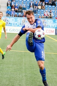 Albert Watson on the volley. PHOTO: FC EDMONTON/TONY LEWIS