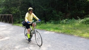 Susan bicycling Mass Central rail trail