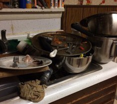 Sink full of dirty dishes.