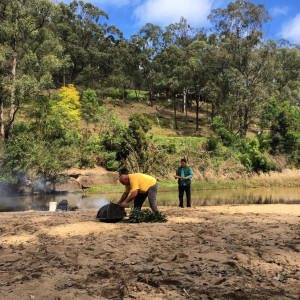 Col Lyons (in the yellow shirt) doing the Welcome to Country smoking ceremony.