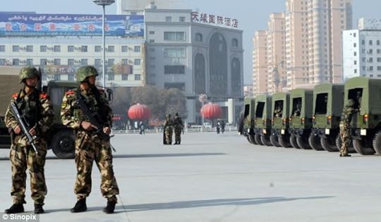 Chinese riot police patrol near the Id Kah Mosque