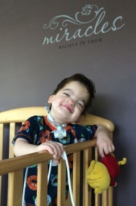 Despite having multiple issues that would keep any of us in bed...Isaac greets most mornings with a smile. Appropriate message on our wall above his crib: Miracles, Believe in Them.