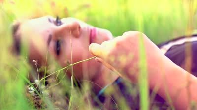  photo stock-footage-beautiful-girl-lying-on-the-meadow-and-dreaming-enjoy-nature-close-up-slow-motion-footage_zpsggnibzis.jpg