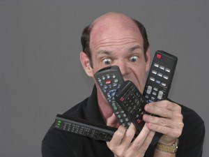 man with too many remotes