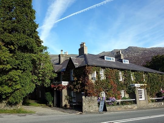 The Pen-y-Gwyrd Hotel stands by the roadside at the foot of Snowdon