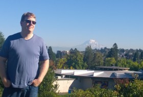 Glenn with Mt, Rainier, a study in blue
