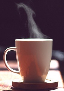 2-cup-of-hot-coffee-close-up-with-steam-over-black-background