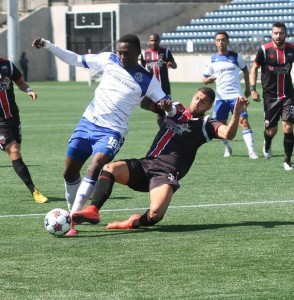 Ottawa defender Rafael Alves tackles Edmonton striker Tomi Ameobi from a game earlier this season. PHOTO: FC EDMONTON/ROBERT MURRAY