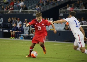 Michael Petrasso (13) in action for Canada.