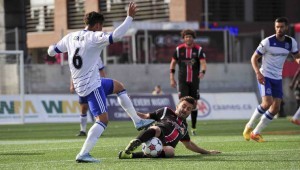 The Fury's Sinisa Ubiparipovic wins the ball from FCE's Dustin Corea. 