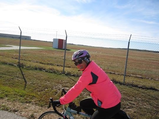 Miss Mary, biking by the old BNAS runway.