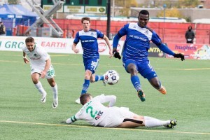Lance Laing, leaping, is seen in action against the New York Cosmos. PHOTO: TONY LEWIS/FC EDMONTON