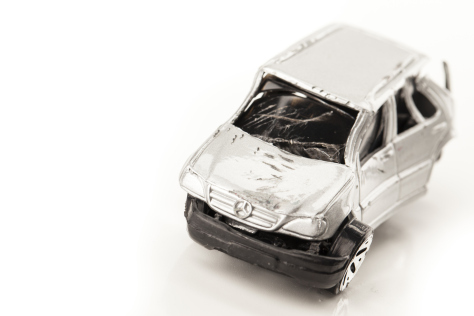 Studio stock image of miniture toy cars smashed up royalty free