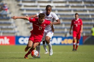Michael Petrasso, in red, is seen in action against Panama. PHOTO: CANADA SOCCER