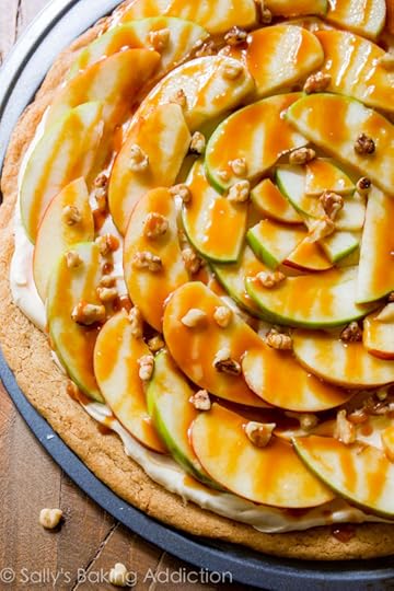 This apple dessert pizza with caramel cream cheese frosting is a show stopped! It's simple to make and it's all prepared on a snickerdoodle cookie crust!