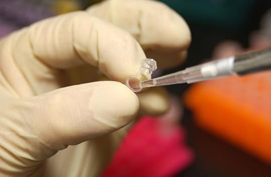 Researcher using a pipette to extract DNA from a micro test tube by Maggie Bartlett, NHGRI. Pubic Domain via Wikimedia Commons.