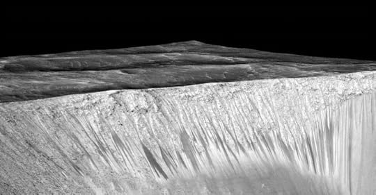 Signs of water? Perspective view of dark narrow streaks (recurring slope lineae) a few hundred metres long on the wall of Garni crater on Mars. Image Credit: NASA/JPL-Caltech/Univ. of Arizona