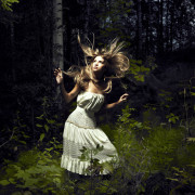 Portrait of romantic woman at fairy forest