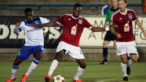 The Eddies' Allan Zebie, left, battles RailHawk Daniel Jackson for the ball. PHOTO: NASL