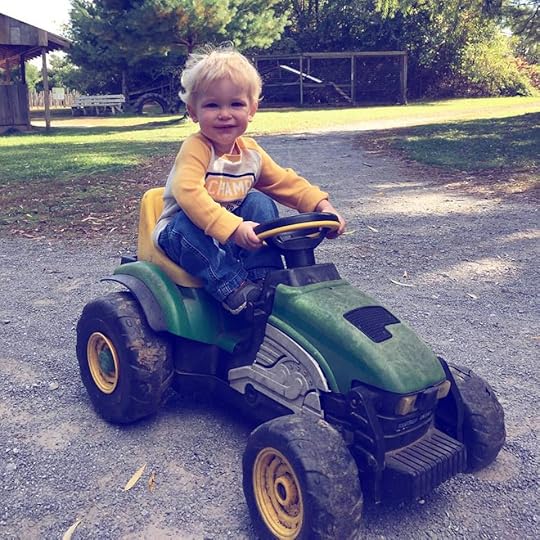 Riding a tractor at the pumpkin patch