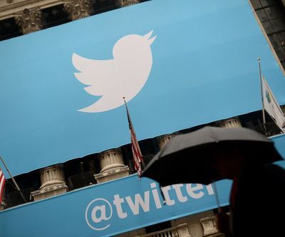 A banner with the Twitter logo on the front of the New York Stock Exchange