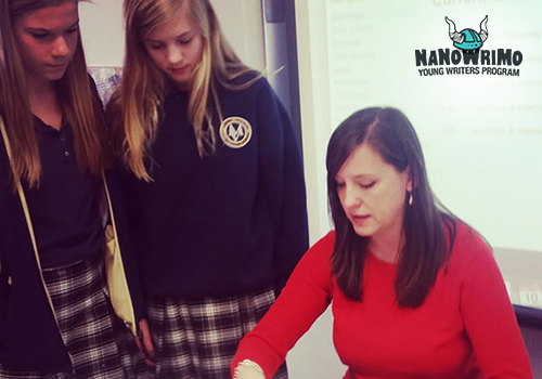 Educator Marie Graham with two students