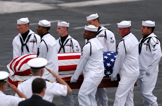 050716-N-0555B-033 San Diego (July 16, 2005) - Pallbearers of the Ceremonial Honor Guard carry the casket of retired Vice Adm. James B. Stockdale during a memorial service held aboard the Nimitz-class aircraft carrier USS Ronald Reagan (CVN 76). Hundreds of friends, family members and shipmates gathered to remember the former prisoner of war and Congressional Medal of Honor recipient who passed away July 5 in Coronado, Calif. U.S. Navy photo by Photographer's Mate Airman Apprentice Christopher D. Blachly (RELEASED)