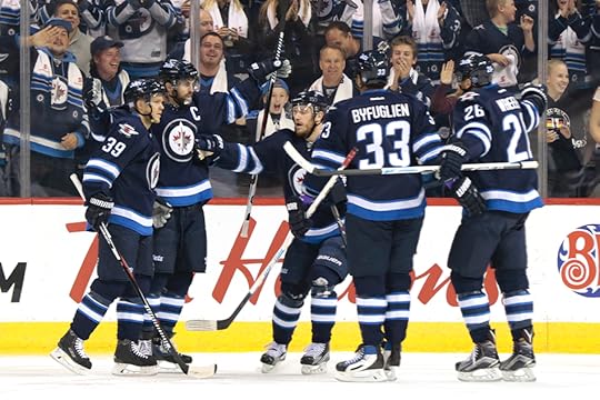 Jets celebrate Bryan Little's goal. (Photo by James Carey Lauder)