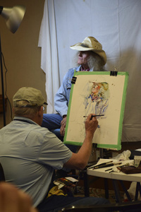 Charles Reid painting from the model in Cache Valley