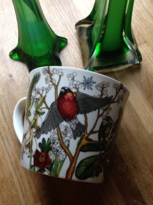 Andra sidan. Domherre, kvistar, snöflingor.