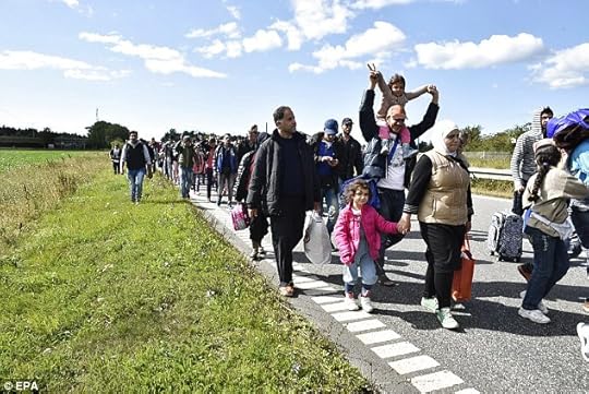 As our population climbs towards 70 million thanks to unrestricted immigration, it gets steadily harder and nastier to get back into my own country. Above, migrants moving north in Denmark