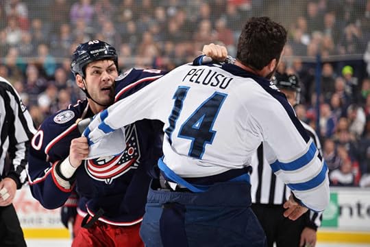 Anthony Peluso and Jared Boll drop the gloves.