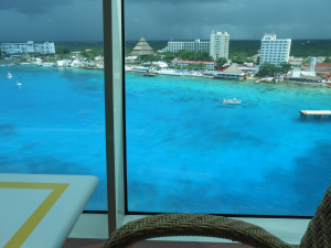 Blue water in the harbor with dark skies overhead
