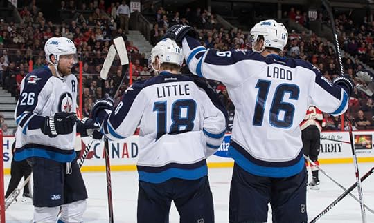 The Jets celebrate Andrew Ladd's goal.
