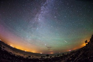 epaselect epa04881779 Meteors from the Perseid meteor swarm burn up in the atmosphere as our own galaxy, the Milky Way, is seen in the clear night sky over the German island of Fehmarn, Germany, early 13 August 2015. The Perseid meteor shower occurs every year in summer when the Earth passes through debris and dust of the 109P/Swift-Tuttle comet. The Perseids, one of the brightest meteorite swarms, consist of a multitude of stellar particles which due to their high speed glow up and burn by entering Earth's atmosphere. EPA/DANIEL REINHARDT