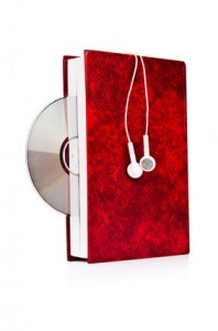 Concept of audio books with earphones on white