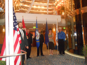 Veterans holding flags from each of the services and the U.S. flag