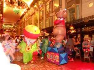 Constumed performaners dance in the circus parade